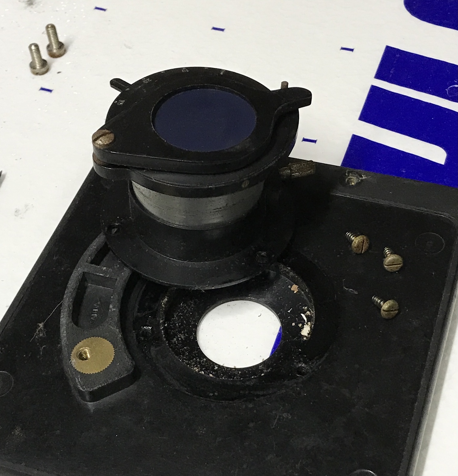 The microscope aperture removed from the stage